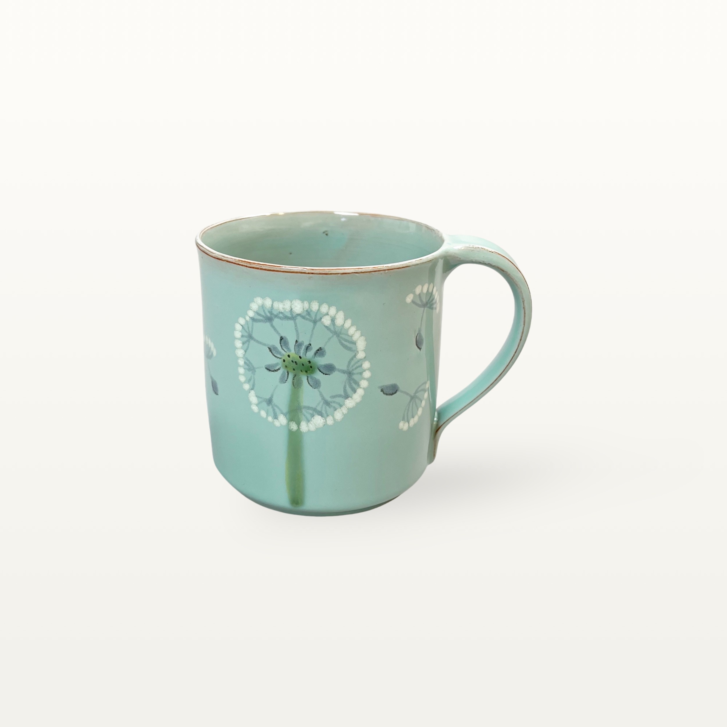 Salbeifarbener Kaffeepott mit Pusteblume
